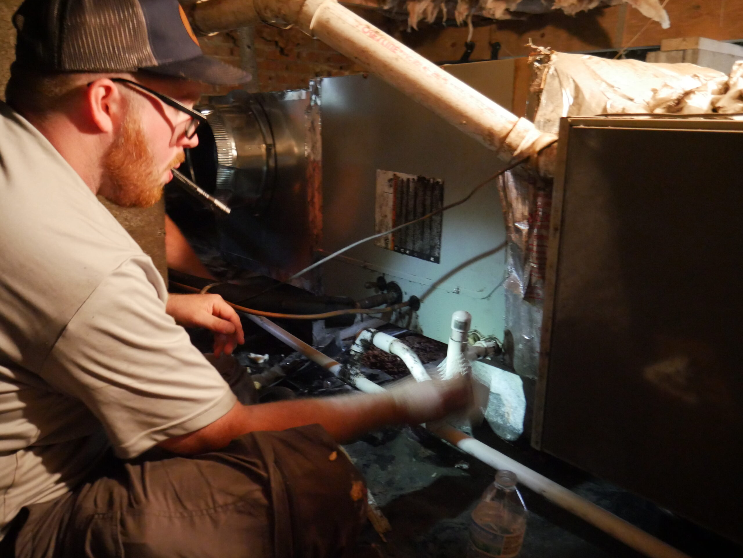 Nathaniel working on an AC unit