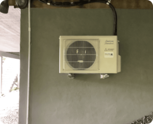 Blue Ridge Heating & Air installing a ductless mini split in a Brevard, NC sunroom