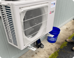 Blue Ridge Heating & Air installing ductless mini split in a great room in Brevard, NC