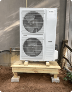 Blue Ridge Heating & Air technician replacing a heat pump unit in Sapphire, NC